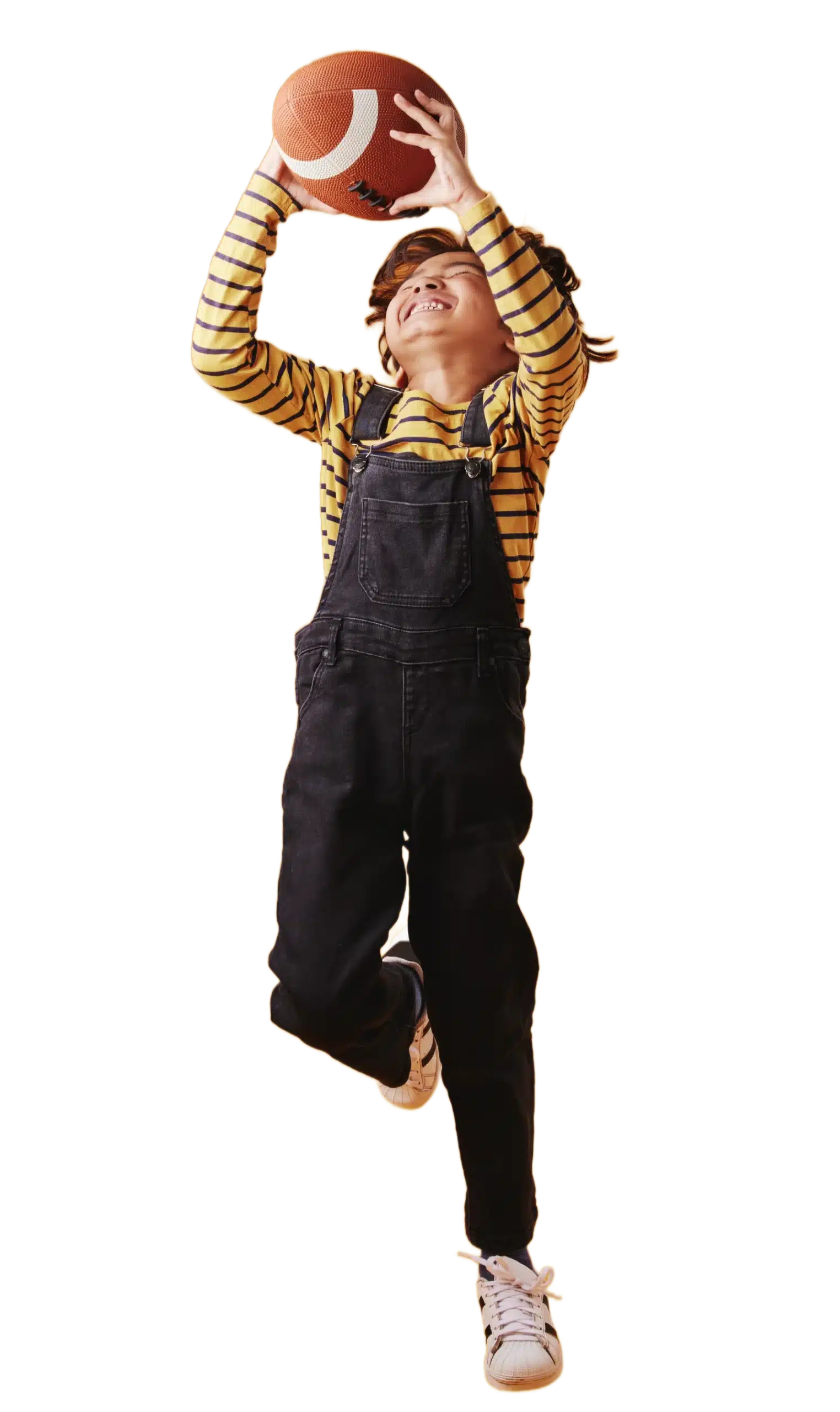 little boy smiling while catching